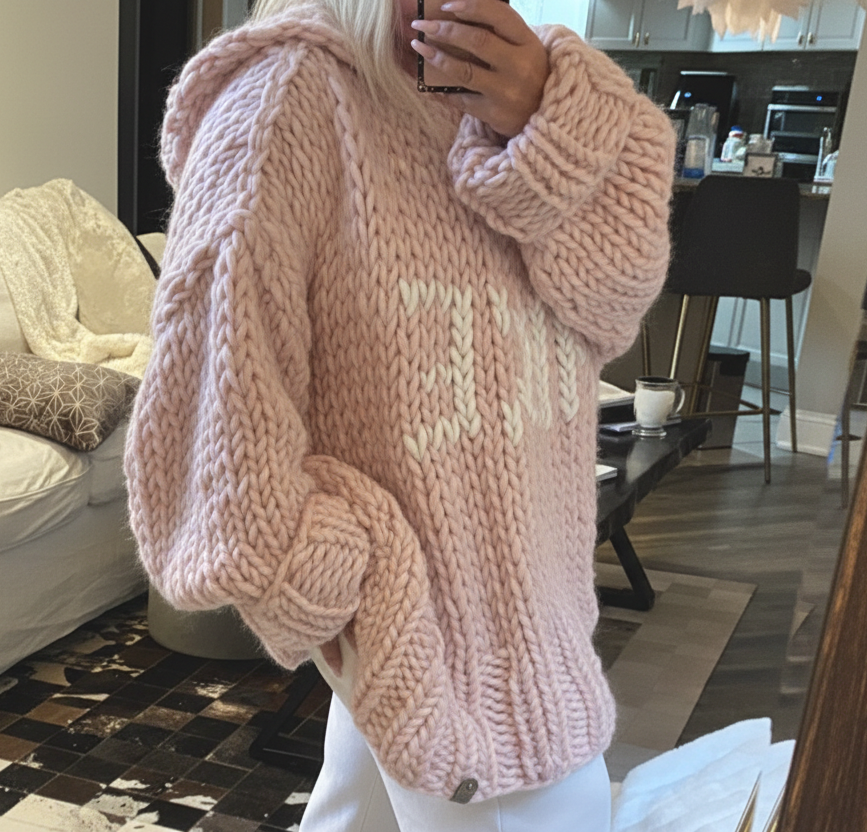 Pink hooded chunky hand knit sweater with ivory lake lettering on a  loose oversized soft luxurious wool sweater for women