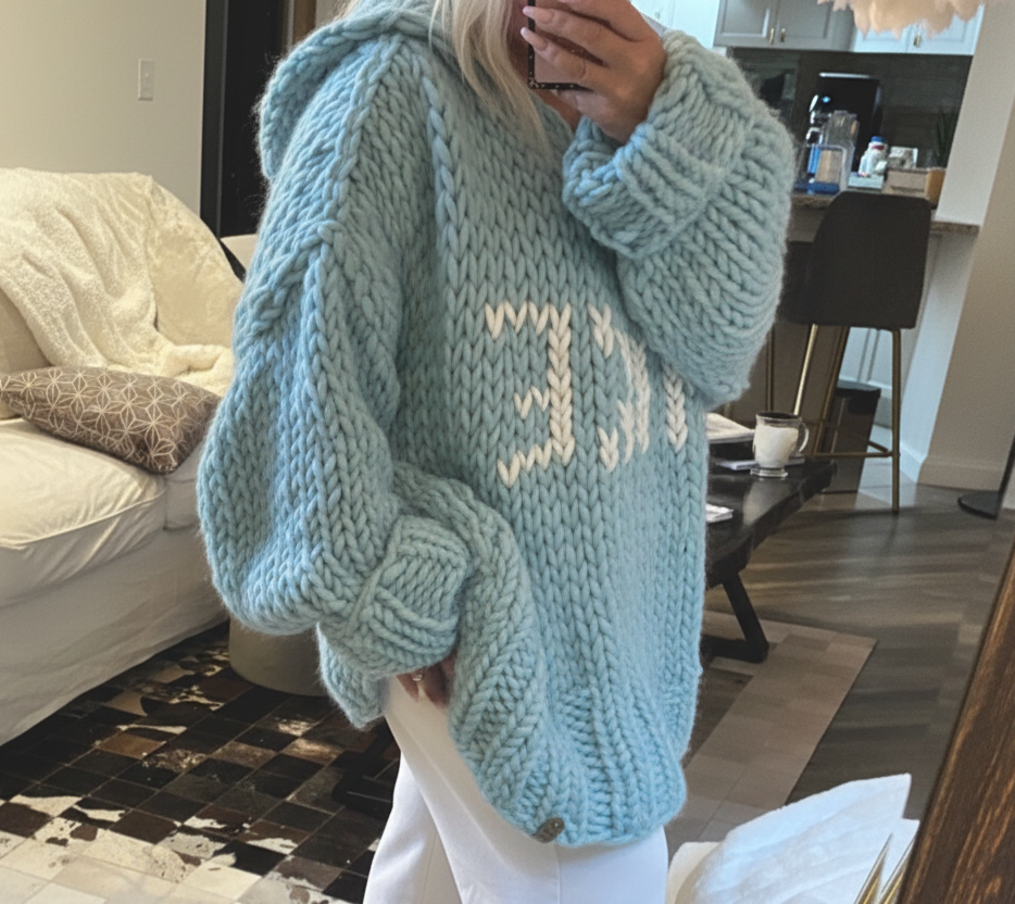  blue duck color hooded chunky hand knit sweater with ivory lake lettering in a loose oversized soft luxurious wool sweater for women